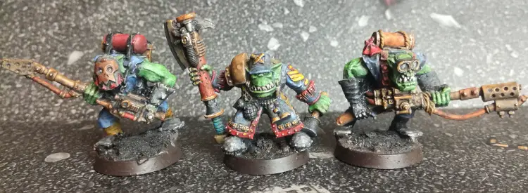 Oldhammer Blood Axe Nob with Big Choppa flanked by two Burna Boyz